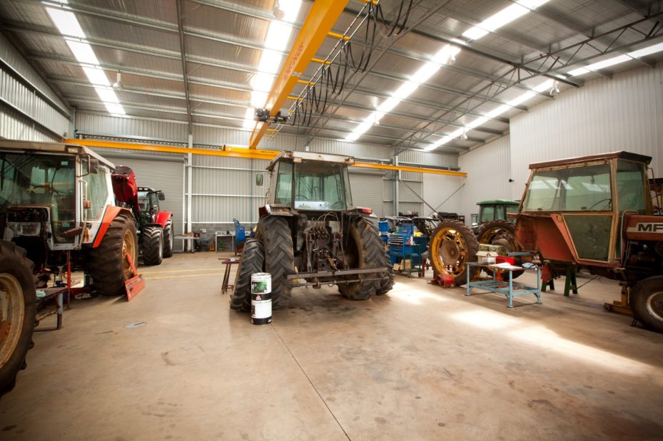 Agricultural workshop construction with overhead crane for farm machinery repairs