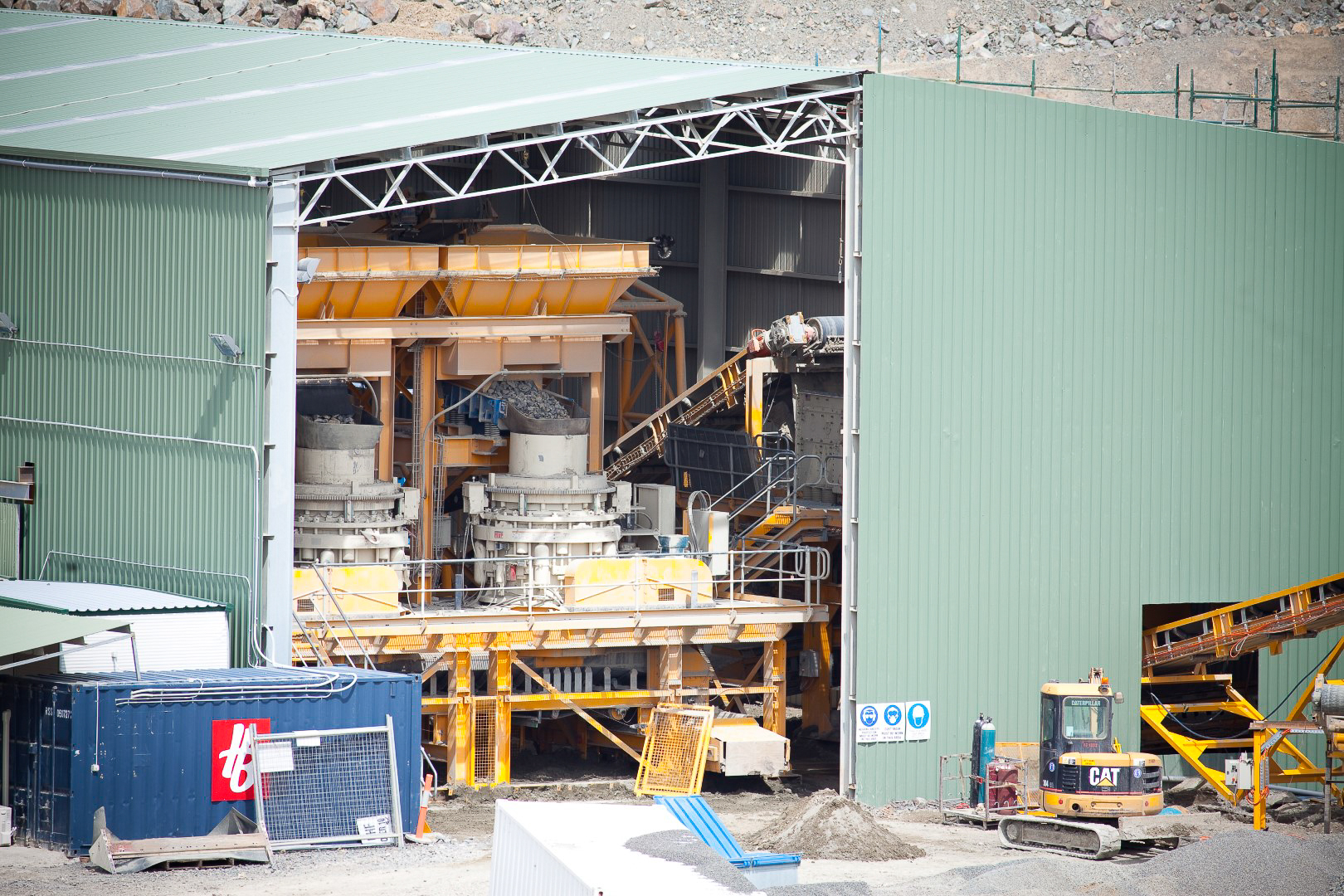 Mining facility in Tasmania with industrial processing equipment inside large building