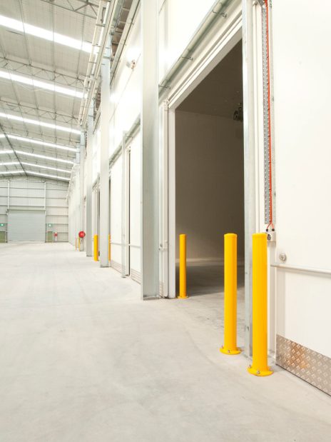 Interior cold storage warehouse with insulated panel walls and high-clearance doors - Agronico Latrobe