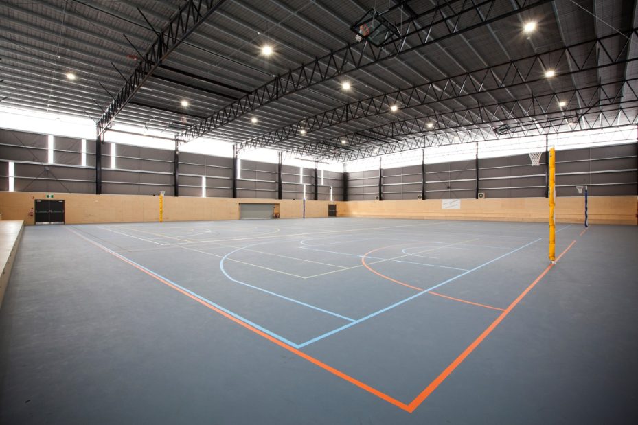 Netball and basketball courts inside Break O'Day Multi-Purpose Stadium showcasing Bison’s sports court construction capabilities.
