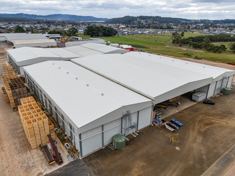Aerial shot of a durable industrial-grade agricultural building in a rural area.