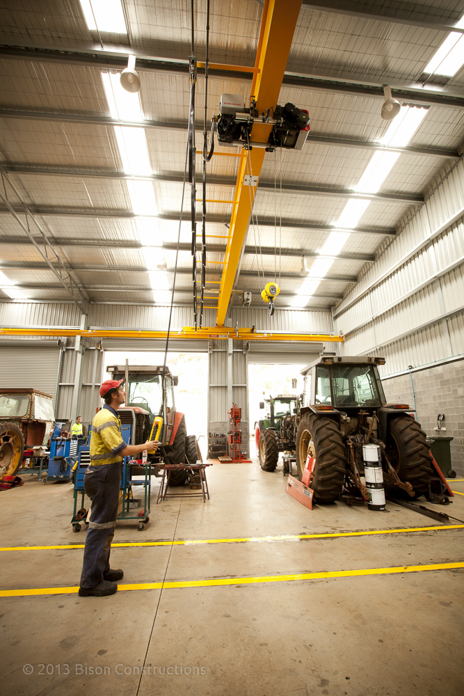 Agricultural workshop construction with overhead crane for farm machinery repairs